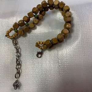 Wood beads w green small beads weaved in